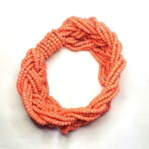 Stretchy Braided Beaded Bracelet. Peach Coral Color